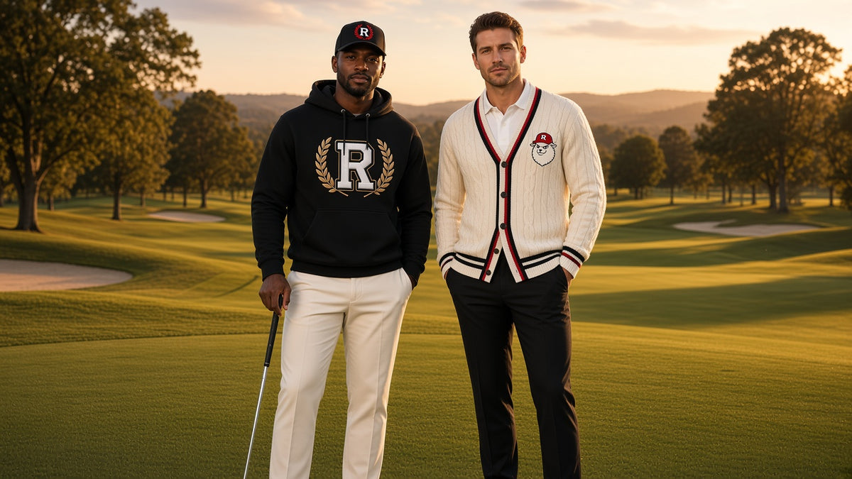 REALIGION Varsity lifestyle: golf course at sunset with the black Wreath R hoodie and black fitted cap and the cream cable-knit cardigan