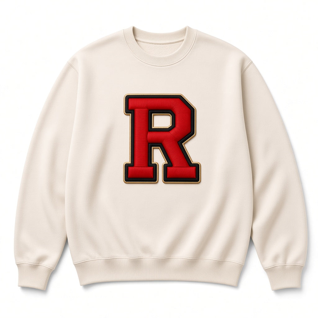 Cream REALIGION Varsity R Crewneck sweatshirt with large red varsity R patch outlined in black and gold