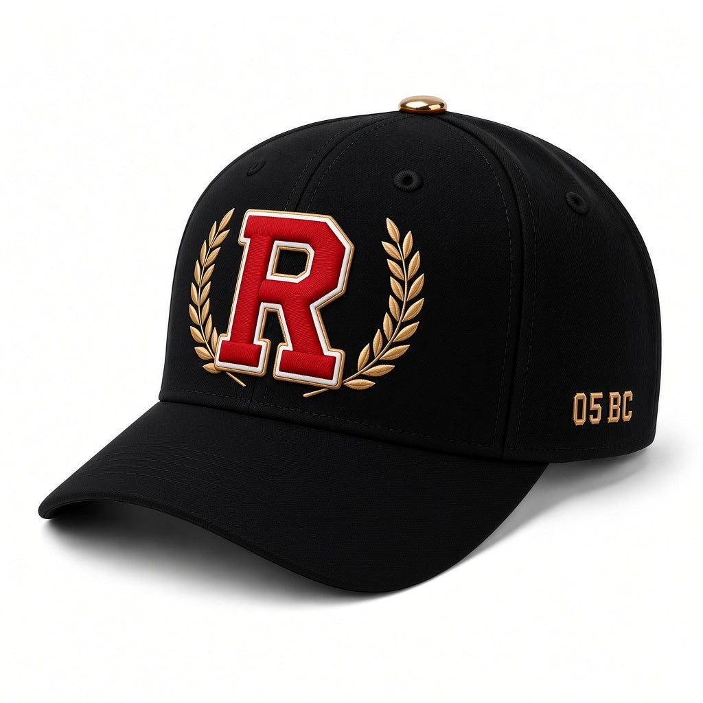 REALIGION Varsity Wreath R Fitted Cap in solid black with raised R inside a gold laurel wreath and gold 05 BC side detail