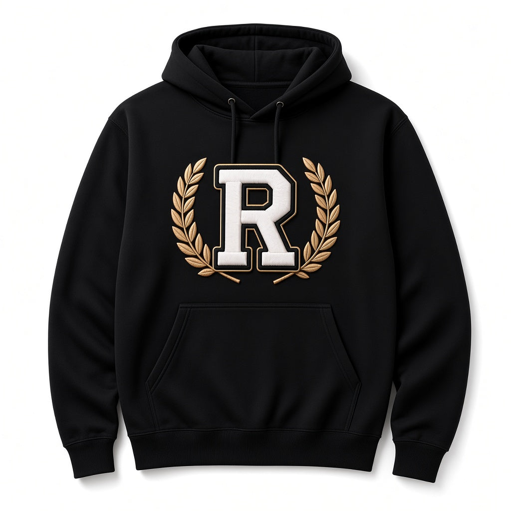 Black REALIGION Varsity Wreath R Hoodie with raised cream R outlined in black and gold inside a gold laurel wreath, kangaroo pocket