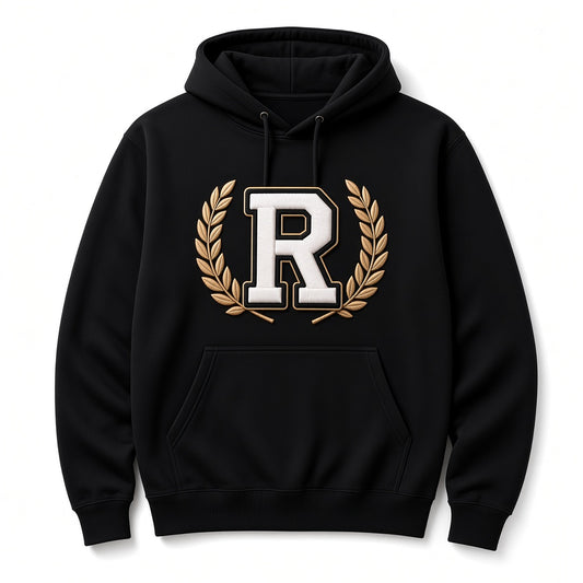 Black REALIGION Varsity Wreath R Hoodie with raised cream R outlined in black and gold inside a gold laurel wreath, kangaroo pocket